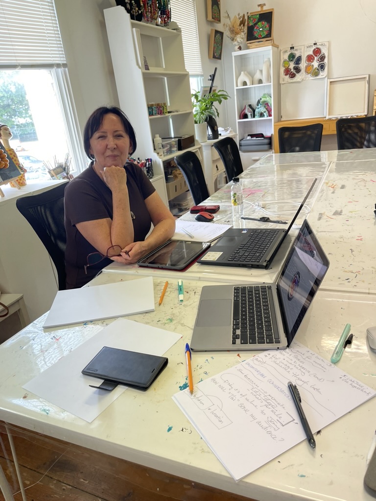 A hirer working at the studio table mid-session